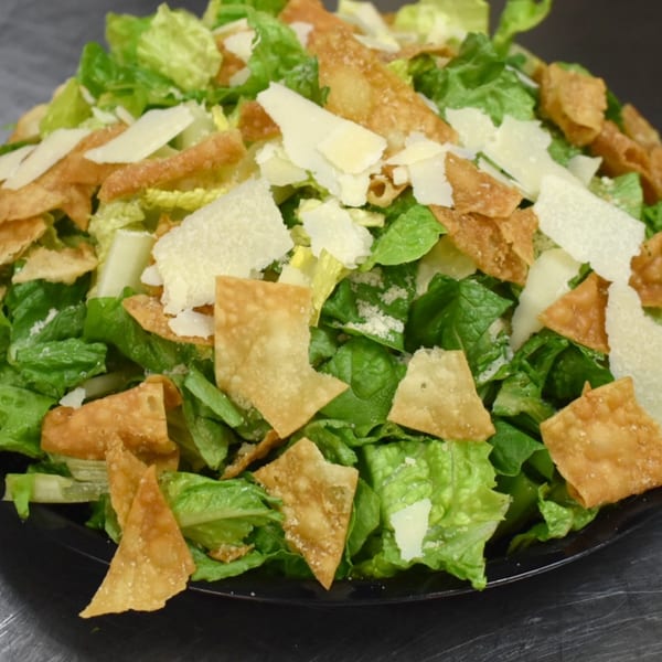 Luciano's Ristorante & Lounge Caesar salad with crisp lettuce, parmesan cheese, and wonton strips.